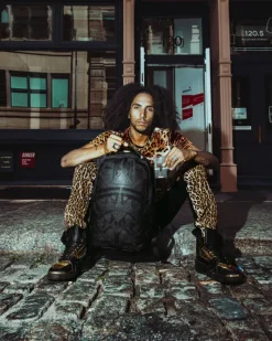AFRICAN INTELLIGENCE 9 APEX GENIUS BACKPACK - SANDFLOWER COLLAB><noscript><img width=