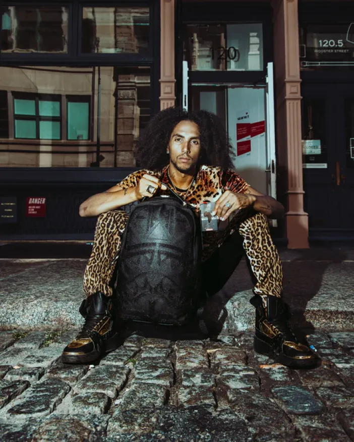 AFRICAN INTELLIGENCE 9 APEX GENIUS BACKPACK - SANDFLOWER COLLAB>SPRAYGROUND New