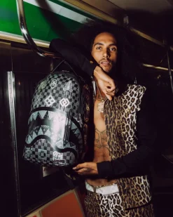 AFRICAN INTELLIGENCE 9 POWER GLYPHICS BACKPACK - SANDFLOWER COLLAB><noscript><img width=
