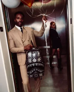 AFRICAN INTELLIGENCE 9 POWER GLYPHICS BACKPACK - SANDFLOWER COLLAB><noscript><img width=