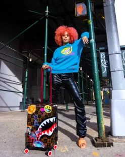 GLOBAL MOGUL POPAGANDA RON ENGLISH EDITION HARDSHELL CARRY-ON LUGGAGE>SPRAYGROUND New