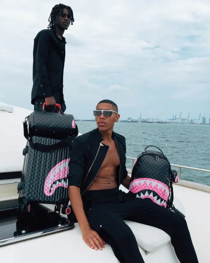 SHARKS IN CANDY CARRY-ON LUGGAGE>SPRAYGROUND